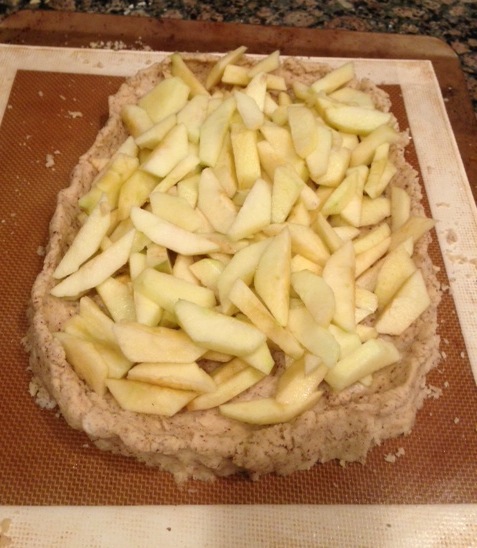 Apples are in the crust, ready for spice mix and baking!